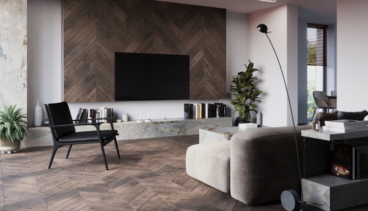 Podłoga FertigDeska Chevron Dąb Color Vento o wzorze jodły francuskiej, która świetnie komponuje się z industrialnymi akcentami matowej czerni i eleganckim kamieniem.