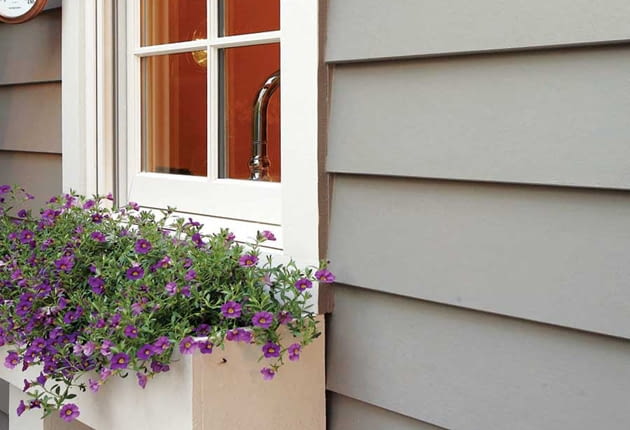 Fiber-cement siding is manufactured to resemble cedar shingles and wood clapboards (either wood-grain or smooth).