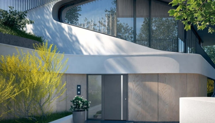 Dobrze dobrane kolorystycznie drzwi wejściowe mogą dyskretnie wpisać się w bryłę budynku, nawet jeśli mają dość duże gabaryty. Na zdjęciu: drzwi stalowe ThermoSafe wzór 568, Ud od 0,88 W/(m?K), z przegrodą termiczną, ocieplone pianką PU, klasa RC3, cena od 12 944 zł (netto), HÖRMANNN