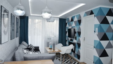 Salon jest stonowany i nowoczesny. para wprowadziła w nim sufit podwieszany. Wasze wnętrza: pomysłowe mieszkanie we wrocławskim bloku