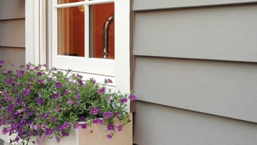 Fiber-cement siding is manufactured to resemble cedar shingles and wood clapboards (either wood-grain or smooth).