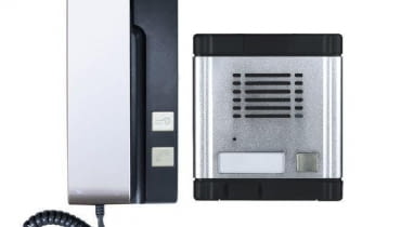 Zestaw domofonowy składający się z modułu zewnętrznego i wewnętrznego - słuchawki.