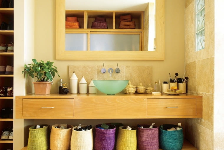 dLondon home decorated in strong colours with textured fabrics and storage ideas for organised living