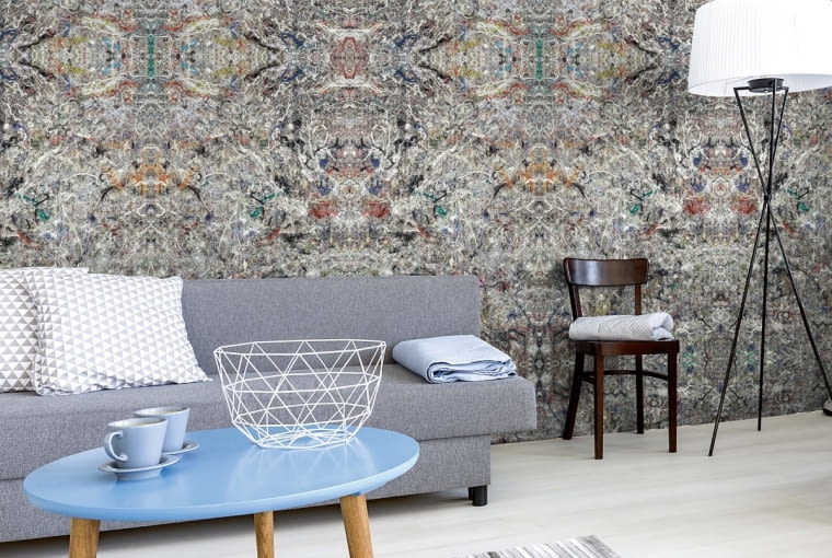 ]Grey living room in minimalist style with sofa, small table, two chairs, desk, and floor lamp