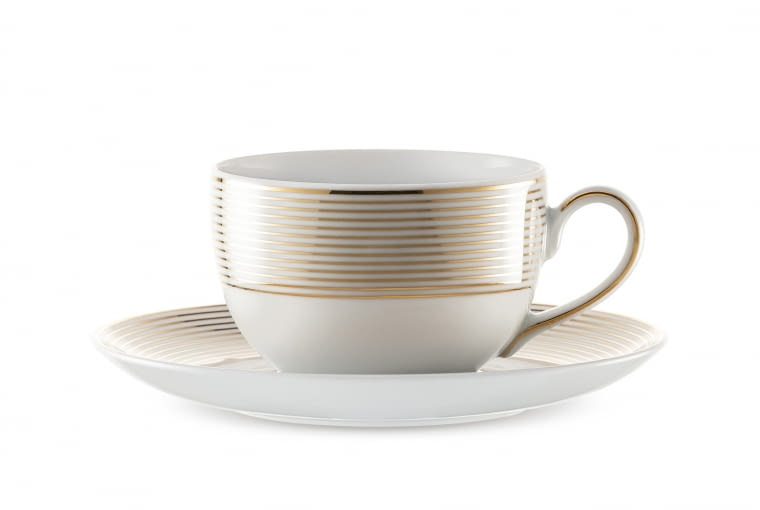 Yvonne Linea Złota, Porcelana Ćmielów, cena: 42 zł. Filiżanka Yvonne Linea to wykwintna propozycja dla każdego miłośnika szlachetnej porcelany. Minimalistyczny wzór wykonano ze szlachetnego złota. Polska Grupa Porcelanowa za sprawą Poczty Porcelanowej, zadba o dostarczenie upominku w Twoim imieniu. Na stronie porcelana.pl, w zakładce „prezent” znajdziesz propozycje filiżanek, które będą idealnym podarunkiem dla ukochanej mamy. Filiżanka z Ćmielowa
