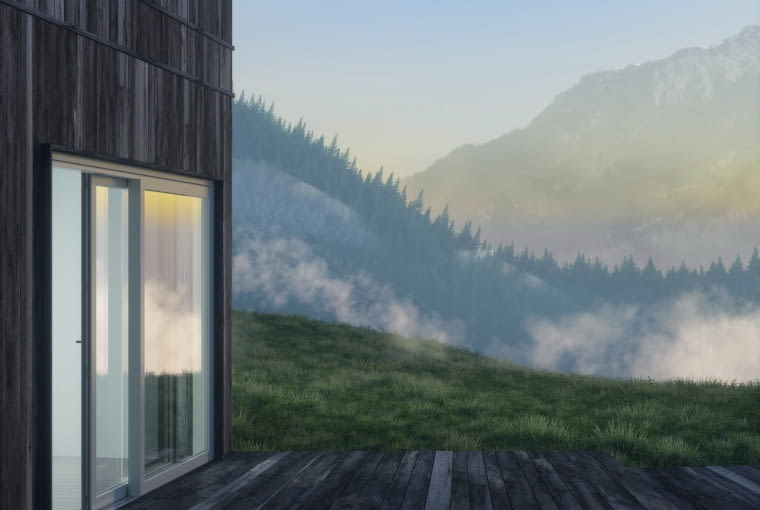 Szklane ściany to idealne rozwiązanie dla domów otoczonych naturą, gdzie widok z okna staje się częścią aranżacji wnętrza