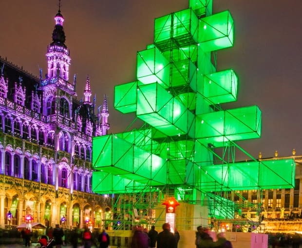 An abstract light installation replaces the traditional Christmas tree at the Grand Place in Brussels, Saturday Dec. 1, 2012. Traditionally, a 20m (65ft) pine tree from the forests of the Ardennes decorates the city's central square, the Grand Place. This year, it has been replaced with a 25m (82ft) construction. (AP Photo/Geert Vanden Wijngaert)