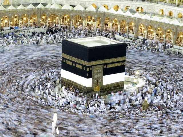 Tens of thousands of Muslim pilgrims moving around the Kaaba, the black cube seen at center, inside the Grand Mosque, during the annual Hajj in Mecca, Saudi Arabia, Saturday, Nov. 13, 2010. The annual Islamic pilgrimage draws 2.5 million visitors each year, making it the largest yearly gathering of people in the world.(AP Photo/Hassan Ammar)