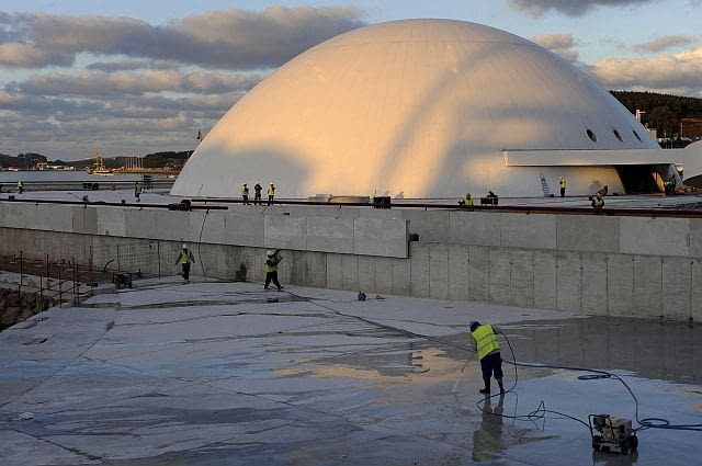Niemeyer Center Construction workers operate at the Niemeyer Center, a cultural complex designed by Brazilian architect Oscar Niemeyer, a day before of the inauguaration of its dome in Aviles, December 14, 2010. The presentation of the UN educational and cultural programme
