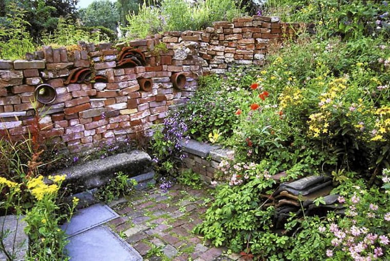 Drystone wall and colourful planting at Wildlife garden, 'Oase' in Netherlands