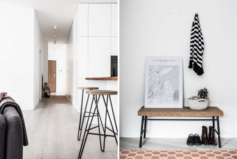 W korytarzu szafy porządkują przejście, dzięki czemu minimalistyczny efekt wow został zachowany. Mapa Kopenhagi na taborecie już od wejścia przypomina właścicielom o tamtym pamiętnym dniu. Przedpokój dzieli mieszkanie na część dzienną i nocną, prywatną - z sypialnią właścicieli, pokojem dziecka i łazienkami.