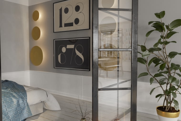 Trzy różnej wielkości kinkiety Lakari powieszone jeden pod drugim stanowią niebanalną dekorację ściany.