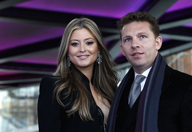 Property developer Nick Candy and actress Holly Valence pose for photographers at the launch of One Hyde Park in London January 19, 2011. REUTERS/Luke MacGregor (BRITAIN - Tags: ENTERTAINMENT BUSINESS)