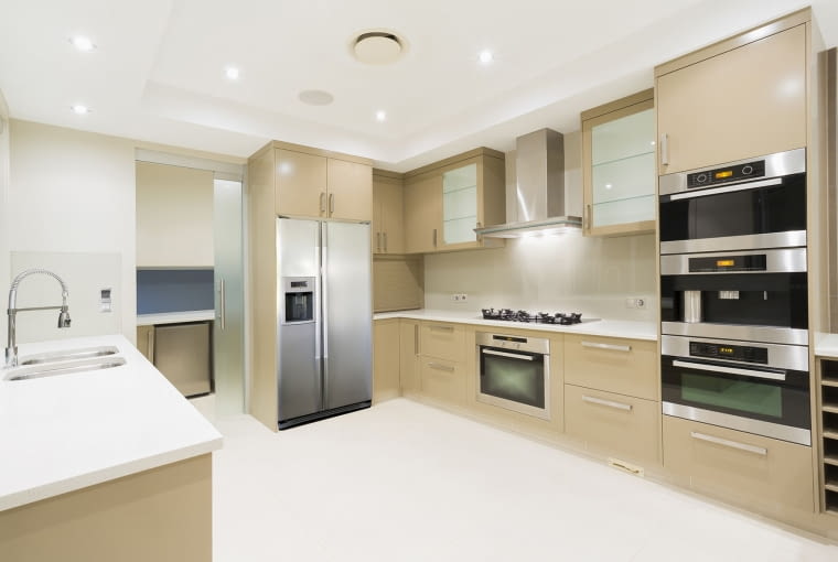 Mowion Domo Modern kitchen with stainless steel appliances in Australian mansion