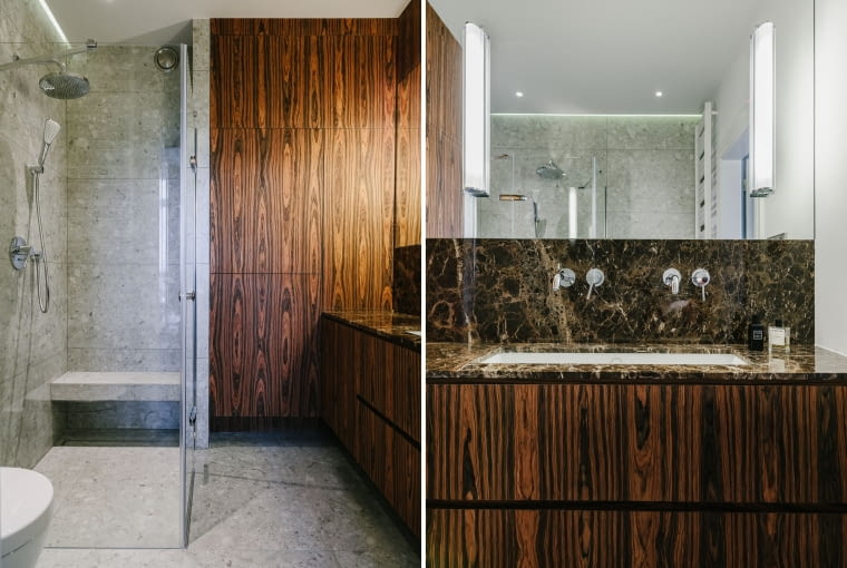 Aranżacja łazienki to połączenie forniru palisander, marmuru Emperador Gold i płytek w odcieniach szarości.