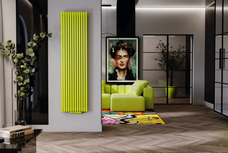 Model zbudowany z pionowych, smukłych tulei ustawionych w rzędzie w regularnych odstępach w kolorze pasującym do aranżacji wnętrza przykuwa uwagę