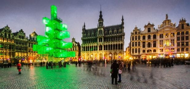An abstract light installation replaces the traditional Christmas tree at the Grand Place in Brussels, Saturday Dec. 1, 2012. Traditionally, a 20m (65ft) pine tree from the forests of the Ardennes decorates the city's central square, the Grand Place. This year, it has been replaced with a 25m (82ft) construction. (AP Photo / Geert Vanden Wijngaert)