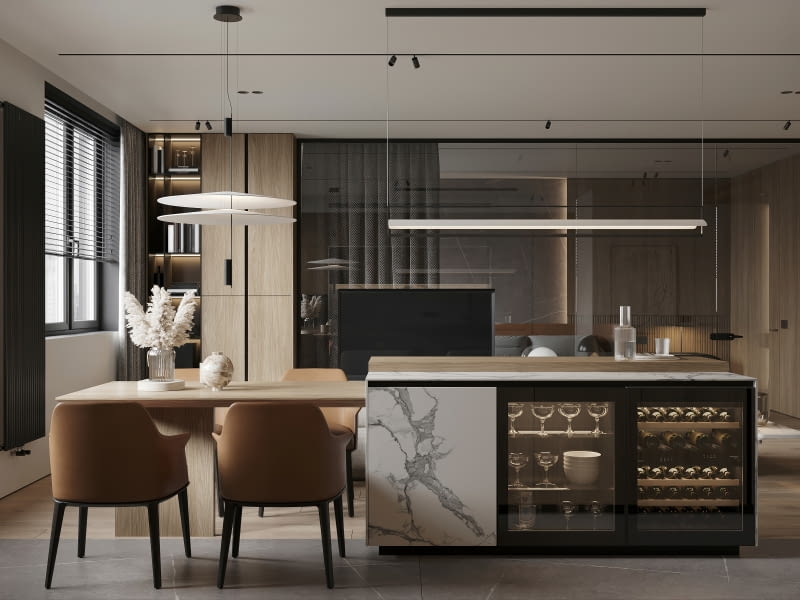 Kuchnia z wyspą i stołem prezentuje się niezwykle stylowo. To rozwiązanie wpisuje się w najnowsze trendy wnętrzarskie, łącząc nowoczesność z elegancją.