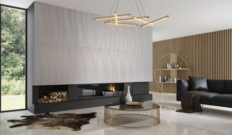 Lśniąca płaszczyzna płytek Elegant Surface ułożonych na dużej powierzchni nad kominkiem zachwyca strukturą rytmicznie układających się fal.