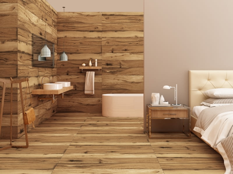 Materiał wykończeniowy ma duże znaczenie w przypadku łazienki w sypialni. Warto zainwestować w odporne na wilgoć materiały, które ułatwią utrzymanie czystości.