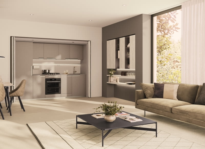 Aneks kuchenny w mieszkaniu typu studio często zakłóca wygląd niewielkiego salonu, w takim wypadku idealnym wyjściem są systemy składanych drzwi, które w jednej chwili ukryją zabudowę.