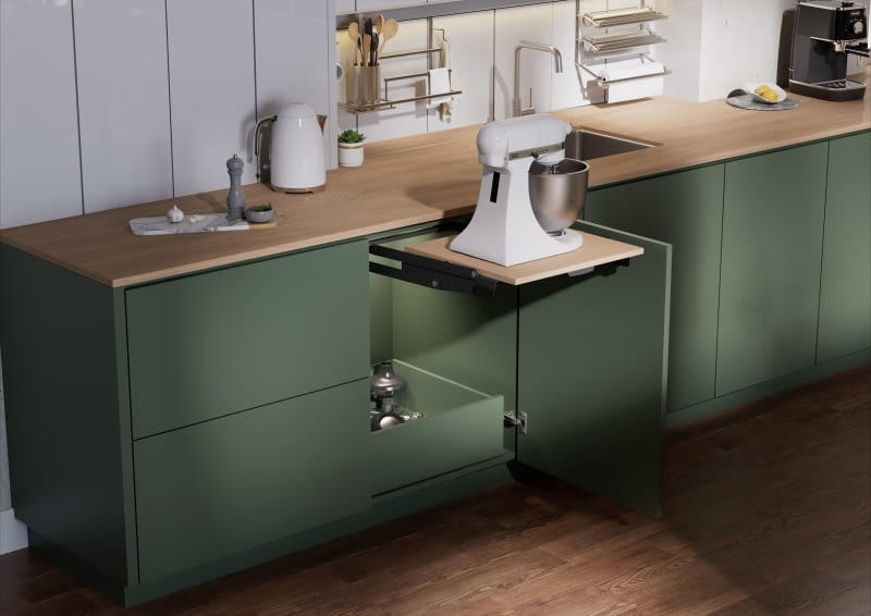 Zazwyczaj to przy zlewozmywaku znajduje się największy fragment blatu roboczego (takie umiejscowienie jest najwygodniejsze), warto więc zaplanować tu szafkę na mały sprzęt AGD, a na ścianie powiesić relingi z wieszakami na ręcznik papierowy, folię spożywczą oraz inne akcesoria.