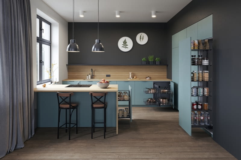 Dzięki półwyspowi zyskujemy więcej miejsca do przechowywania. Warto zamontować tu praktyczne wysuwane kosze.