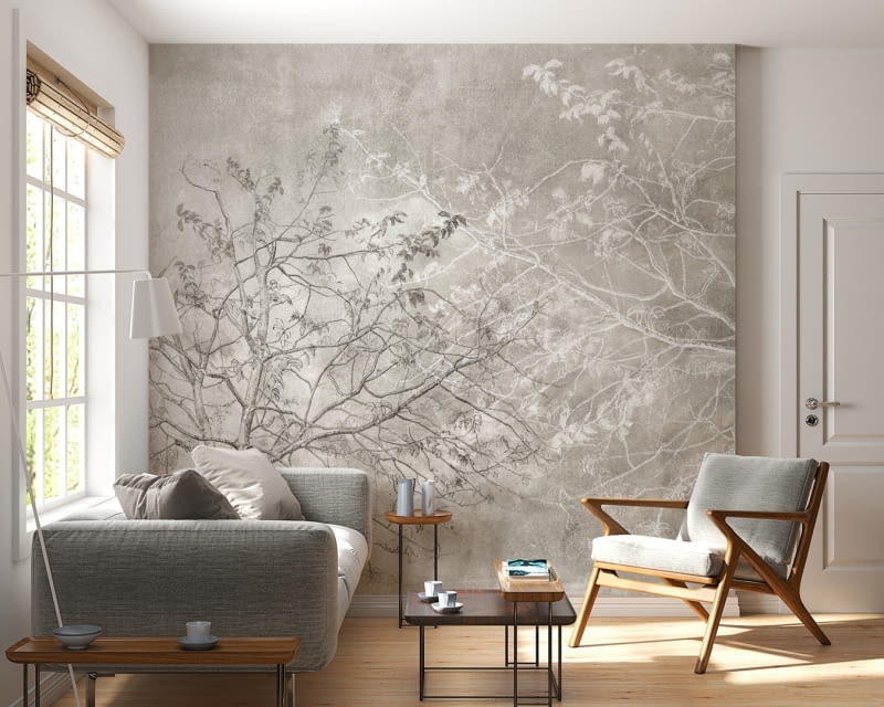 Szarości i biele w połączeniu z drewnem sprzyjają odprężającej atmosferze. Kontynuujący kolorystyczny rygor subtelny rysunek koron drzew z tapety dopełni wrażenie estetycznego, ale zarazem przytulnego wnętrza.