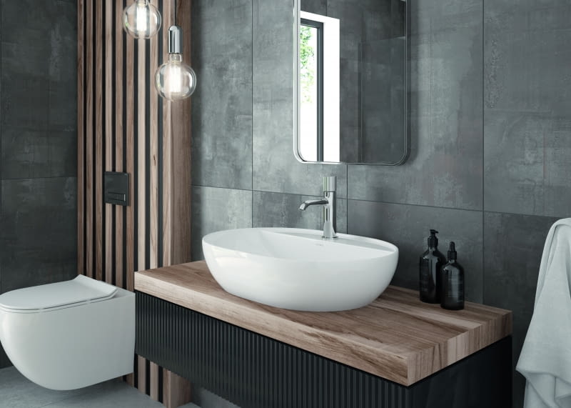 Przykład minimalistycznej elegancji – niska bateria o futurystycznym kształcie z grawerowanym pokrętłem, które pełni funkcję uchwytu.