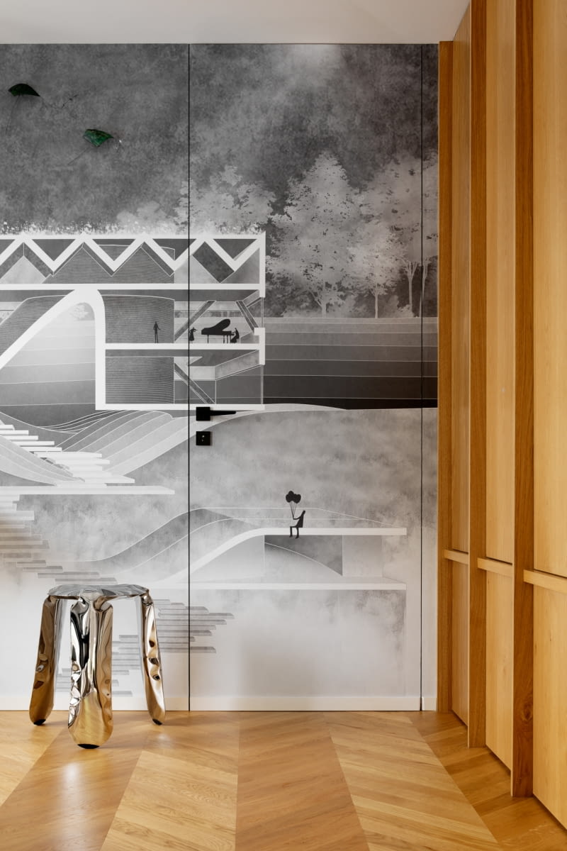Mikro-apartament i pracownię odgradza ściana wykończona autorską fototapetą, która przedstawia artystyczną interpretację krakowskiego projektu – Domu z Grotą inspirowanego legendą o Smoku Wawelskim Mikro-apartament i pracownię odgradza ściana wykończona autorską fototapetą, która przedstawia artystyczną interpretację krakowskiego projektu – Domu z Grotą inspirowanego legendą o Smoku Wawelskim