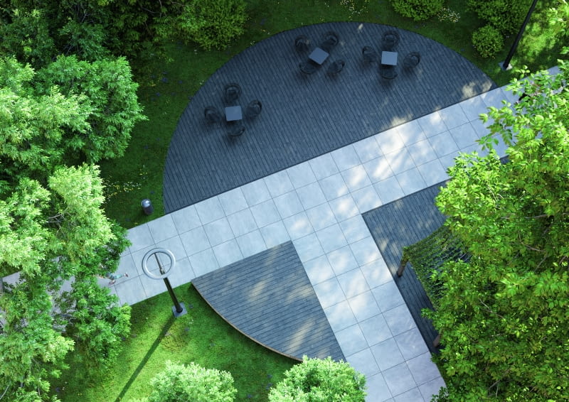 Zestawienie kontrastowych materiałów pozwala na wizualne rozgraniczenie różnych obszarów lub podkreślenie stref w ogrodzie