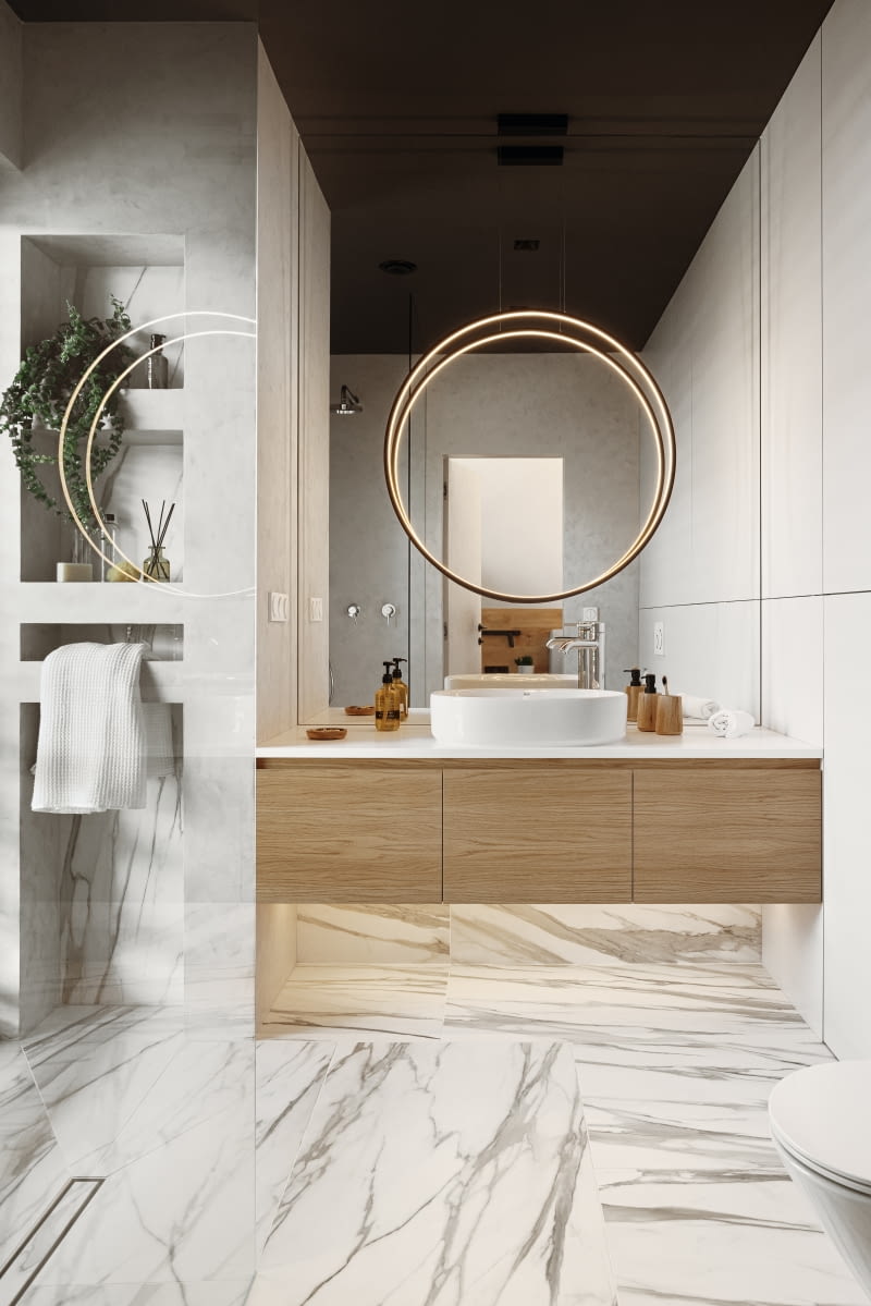 W łazience rodziców sufit pomalowano dla kontrastu na kolor grafitowy. Duże, sięgające do niego lustro przyklejone nad umywalką potęguje wrażenie dublowania ciemnej powierzchni i tej części pomieszczenia, której widok się w nim odbija. Ładnie wygląda zwłaszcza odbicie lampy-obręczy wiszącej nad lustrem. To model Echo marki Ramko, montowany do sufitu.