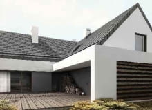 Dom składa się z dwóch brył, które przecinają się pod kątem prostym. W miejscu ich połączenia udało się stworzyć zaciszny taras dom jednorodzinny, projekt, dwuspadowy dach, taras