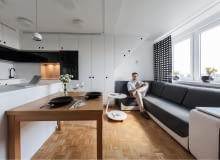 Wyspa kuchenna i stół stanowią granice między kuchnia i salonem