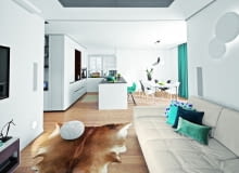 Na otwartą strefę dzienną składa się przedpokój, kuchnia z jadalnią i salon. Takie rozwiązanie sprzyja rodzinnej integracji; większość czasu domownicy spędzają w strefie dziennej. Na sofie Maxdivani poduszki NAP oraz Bo Concept, skóra na podłodze IKEA, puf House & More.