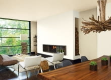 Decyzję, gdzie i jaki kominek zainstalujemy, podejmujmy jeszcze na etapie projektowania domu. Wówczas najłatwiej wybrać dobre usytuowanie komina. kominek,salon