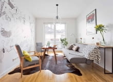 Lekkie meble, niezagracona przestrzeń, jasna neutralna kolorystyka - to wszystko sprawia, że niewielki pokój o wydłużonym kształcie wydaje się większy i bardziej proporcjonalny, niż jest w rzeczywistości.