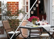 Designerski świecznik ogrodowy z pnia i rury metalowej