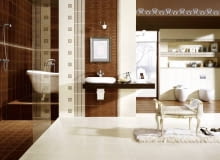 Część ścian wyłożono płytkami z roślinnym wzorem. Stylizowana wanna i nablatowa umywalka podkreślają styl łazienki. Część ścian wyłożono płytkami z roślinnym wzorem. Stylizowana wanna i nablatowa umywalka podkreślają styl łazienki.