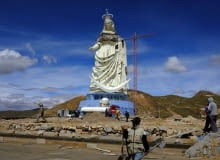 People work at the base of the Virgin of the Socavon (patron saint of miners) statue during its construction at the Santa Barbara hill in the outskirts of the Oruro, some 200 km (124 miles) south of La Paz, January 18, 2013. The statue measures 45 metres (148 feet) in height and stands at 3850 meters (12,631 feet) above sea level. The statue is expected to complete by February 2, 2013 according to its sculptors. REUTERS/David Mercado (BOLIVIA - Tags: RELIGION SOCIETY)