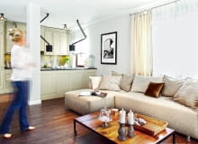 MEBLE KUCHENNE z frontami z lakierowanej płyty MDF zrobiono na zamówienie według projektu architektek. Ponieważ kuchnia jest całkowicie otwarta na pokój dzienny, gospodarze nie chcieli eksponować sprzętów AGD. Dlatego wybrali lodówkę do zabudowy i okap podszafkowy. Nie ma też otwartych półek ani ażurowych witryn - wszystko jest schowane w szafkach. Słup to pozostałość po wyburzonej ścianie. Razem z półwyspem symbolicznie oddziela kuchnię od pokoju dziennego.