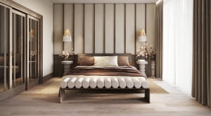 Jasne, stonowane barwy: beże, kremy i ciepłe szarości podkreślają urodę ciemnego drewna, nie obciążając przestrzeni.