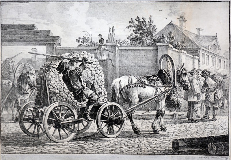 Візник, що вантажить дрова на віз