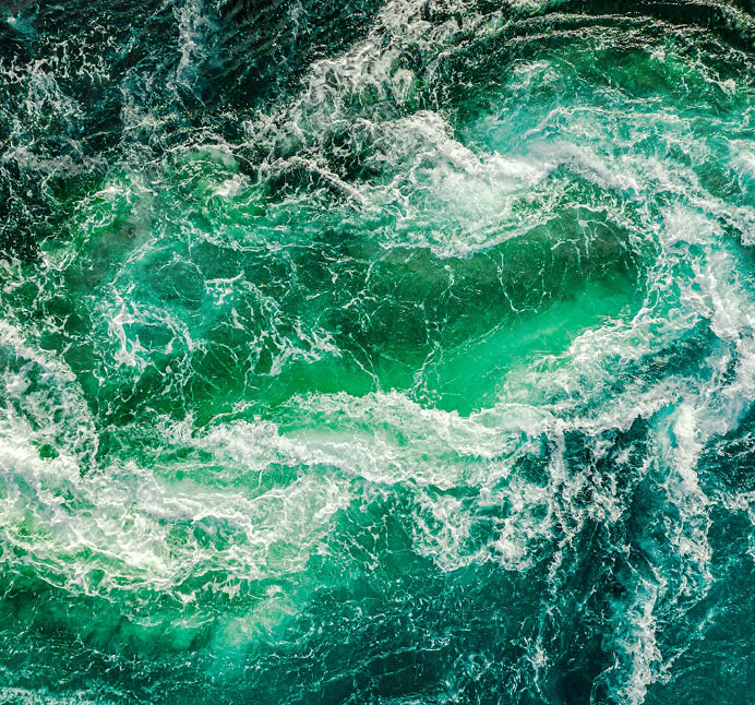 Abstract background  Waves of water of the river and the sea meet each other during high tide and low tide  Whirlpools of the maelstrom of Saltstraumen, Nordland, Norway