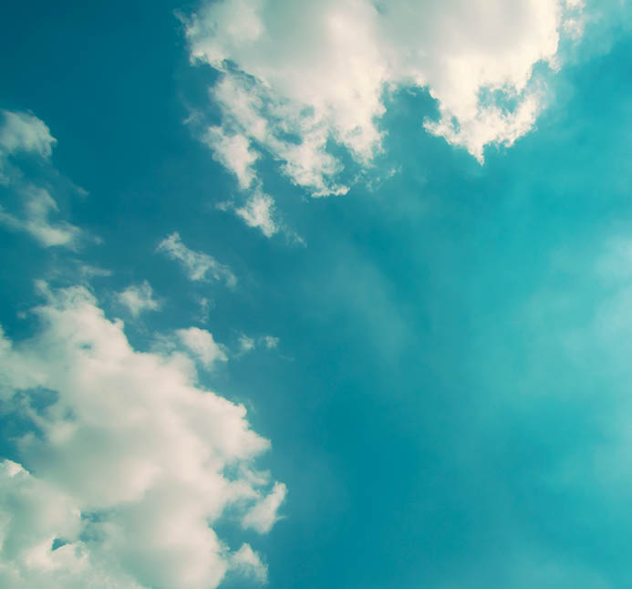 sunlight shining through clouds sky background