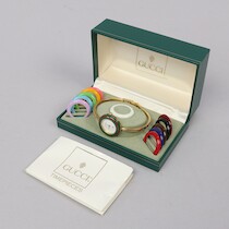GUCCI "Change Bezel" 1100-L i förpackning med äkthetsintyg/garantibevis samt instruktionsbok. Inköpt 10/10-198 på auktion i Skåne hos Sikö Auktioner