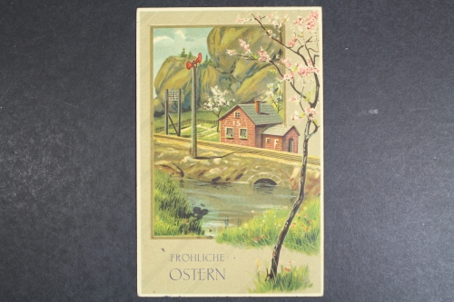 Fröhliche Ostern, blühender Baum, Haus an der Bahnlinie, Prägekarte