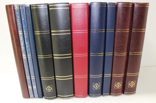 Einsteckalben-Posten, 11 gebrauchte Einsteckalben mit schwarzen Seiten