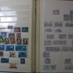 Briefmarken Posten, 12 Alben mit Marken aus vielen Ländern