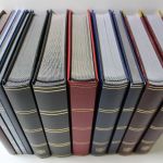 Einsteckalben-Posten, 11 gebrauchte Einsteckalben mit schwarzen Seiten